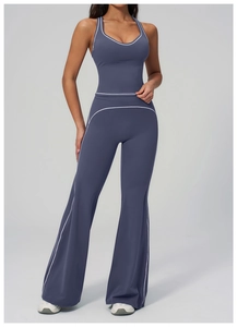 Detail of high-waist flare yoga pants and camisole set with white contrast piping