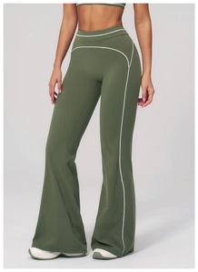 Detailed view of olive green flare yoga pants featuring contrast white piping and high waist