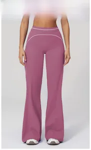 Detail of high waisted flare yoga pants in Fig Purple with white curved seam accents