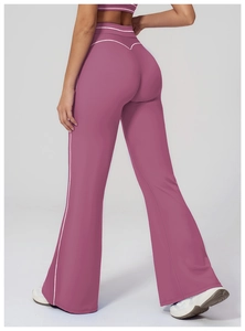 Detail of high-waisted yoga pants featuring back-lifting fit and contrast white piping trim