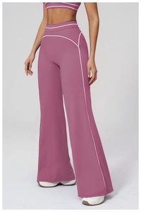 Detail view of high-waist flared yoga pants with contrast piping for women in dusty pink