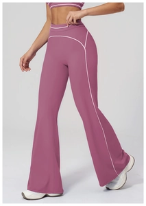 Detail of dusty pink high-waisted flared yoga pants with white side stitching
