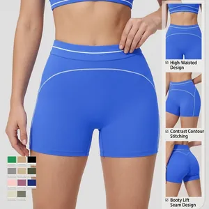 High-waisted yoga shorts in electric blue with white contrast stitching and curved hip seams
