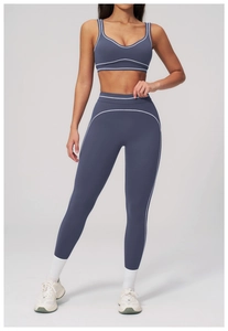 Full body view of smog blue yoga set with contrast white stripes and high waist fit