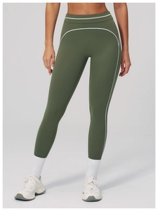 Detail view of olive green yoga pants with high waist and white contrast stitching