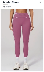 Detail of high waisted yoga leggings in fig purple with contrast stitching for gym workouts