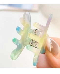 Macro shot of a mini acetate hair claw clip with colorful macaron gradient finish