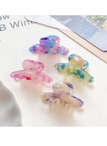Detailed set of four marble textured acetate hair claws in pastel colors for women