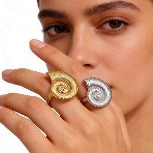 Spiral shell rings in gold and silver finish with textured 18k plated stainless steel