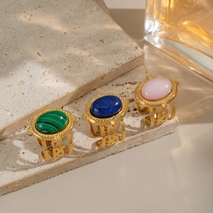 Three vintage adjustable stainless steel rings with oval turquoise and colorful stones