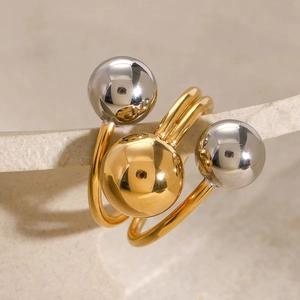Polierter offener Edelstahlring mit gold-silbernen Kugeln im mehrlagigen Design