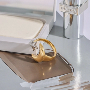 Minimalist moon and star open ring in polished gold and silver stainless steel
