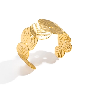 Vintage gold-plated stainless steel cuff bracelet featuring detailed leaf motifs in a nature-inspired design