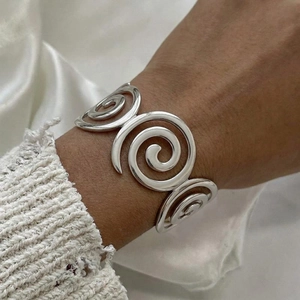 Minimalist silver wide spiral cuff bracelet with polished concentric circles design for women