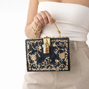 Luxury black acrylic clutch with gold floral hollow metal carving and rhinestone detail