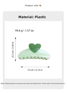 Detail showing dimensions of a large light green heart hair claw clip in plastic