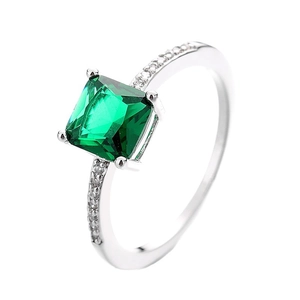 Vintage emerald-cut green gemstone ring with pavé cubic zirconia on silver band