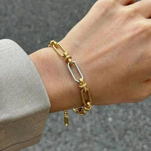 Two-tone mixed metal chunky chain bracelet with gold links and silver accent for women