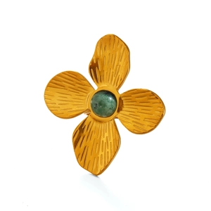 Golden flower ring with green natural stone inlay and textured petal design