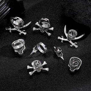 Macro detail of Gothic skull and crossbones silver pins with retro distressed texture