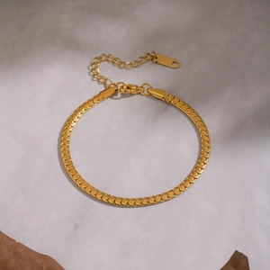 Elegant gold-plated herringbone snake chain bracelet with adjustable lobster clasp closure