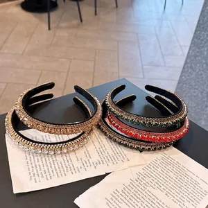 Elegant velvet headbands with sparkling rhinestones in champagne, emerald, and burgundy