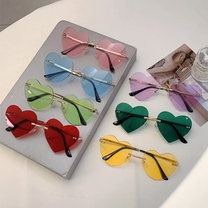 Detailed collection of heart-shaped rimless sunglasses in seven candy colors with metal frames