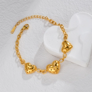 Golden stainless steel chain bracelet featuring hollow heart charms in a minimalist design