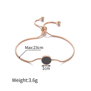Adjustable rose gold snake chain bracelet with black circular pendant and bead slider