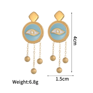Golden stainless steel evil eye tassel earrings with blue enamel and polished metal beads