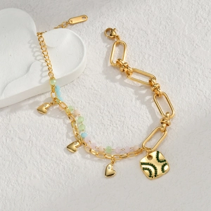 Gold layered heart bracelet with colorful beads and geometric square pendant charms
