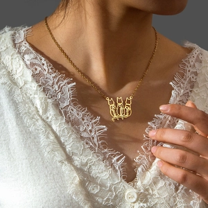 Custom gold stainless steel necklace featuring three cat silhouettes with personalized names