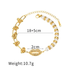Gold stainless steel lip pendant bracelet with pearls and twist chain detail