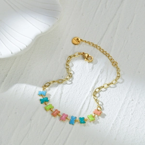 Bracelet à breloques os colorés en acier inoxydable plaqué or 14K sur fond de pierre blanche