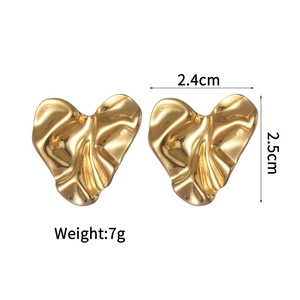 Detail view of gold heart stud earrings with vintage pleated texture and 2.5cm size