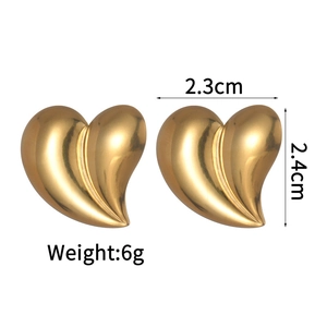 Detail view of gold heart stud earrings showing 2.3cm by 2.4cm dimensions and 6g weight
