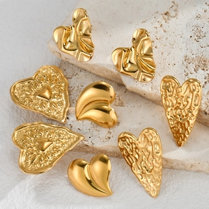 Set of four textured golden heart earrings with vintage minimalist stainless steel design