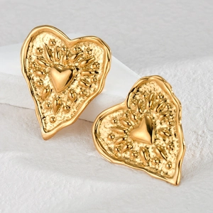 Textured 18k gold heart stud earrings with vintage embossed lava style metal surface