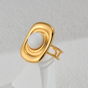 Gold geometric open ring with white round cabochon stone and hollow double band