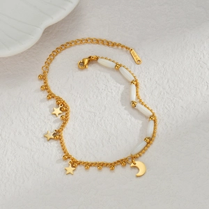 Gold stainless steel star and moon charm bracelet with white shell bead accents