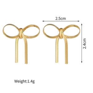 Detail of gold bow earrings with snake chain texture showing 2.5cm width dimensions