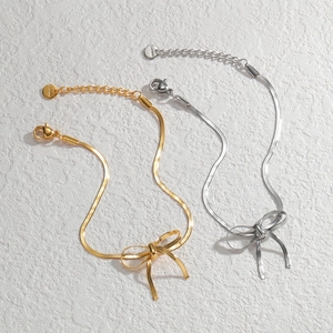 Elegant stainless steel bow snake chain bracelet set in gold and silver finishes