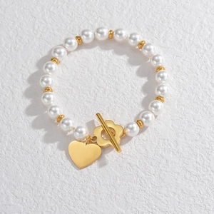 Bracelet élégant en perles et billes d'or avec fermoir OT et pendentif cœur