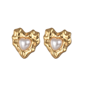 Elegant gold heart earrings with hammered texture and faux pearl center on white background