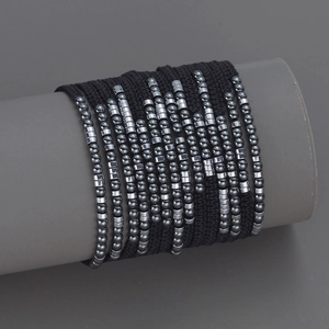 Handmade woven constellation bead bracelet with black cord and gunmetal metallic beads