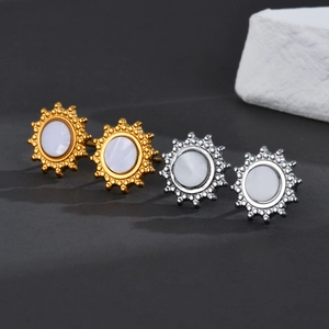 Minimalist sunburst stud earrings in gold and silver finish with iridescent shell inlay