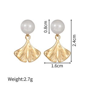 Detailed view of gold ginkgo leaf earrings with white pearls and size measurements