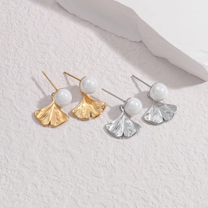 Ginkgo leaf pearl drop earrings set in gold and silver finish with detailed leaf textures
