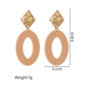 Detailed view of geometric stainless steel earrings with woven texture and size specs