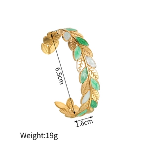 Detail view of 18K gold C-shaped leaf bangle showing dimensions 6.5cm and 19g weight